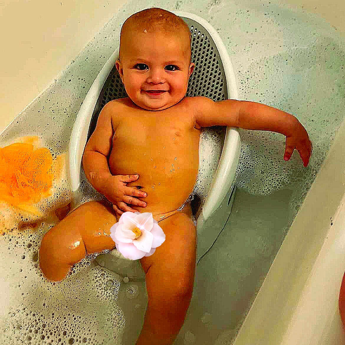 Jonathan Jr. is registered to the contest to win money with this photo: baby, bathtub, bubble_bath, child, smiling, water, bath_seat, foam, skin, relaxing, infant, sitting, clean, happy, young_child, bathroom, cute, one_person, indoors, flower_sticker