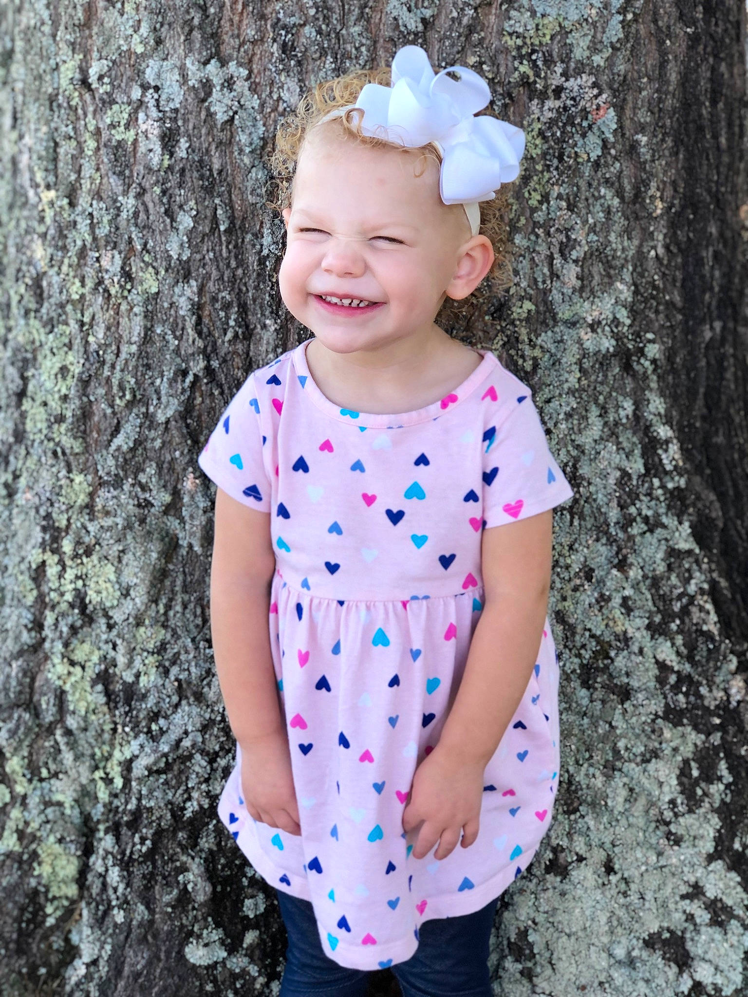 Symphony is registered to the contest to win money with this photo: baby_toddler_clothing, beauty, day_dress, electric_blue, face, happy, head, headband, joy, leaf, magenta, one_piece_garment, pattern, people_in_nature, person, photograph, pink, sleeve, smile, standing