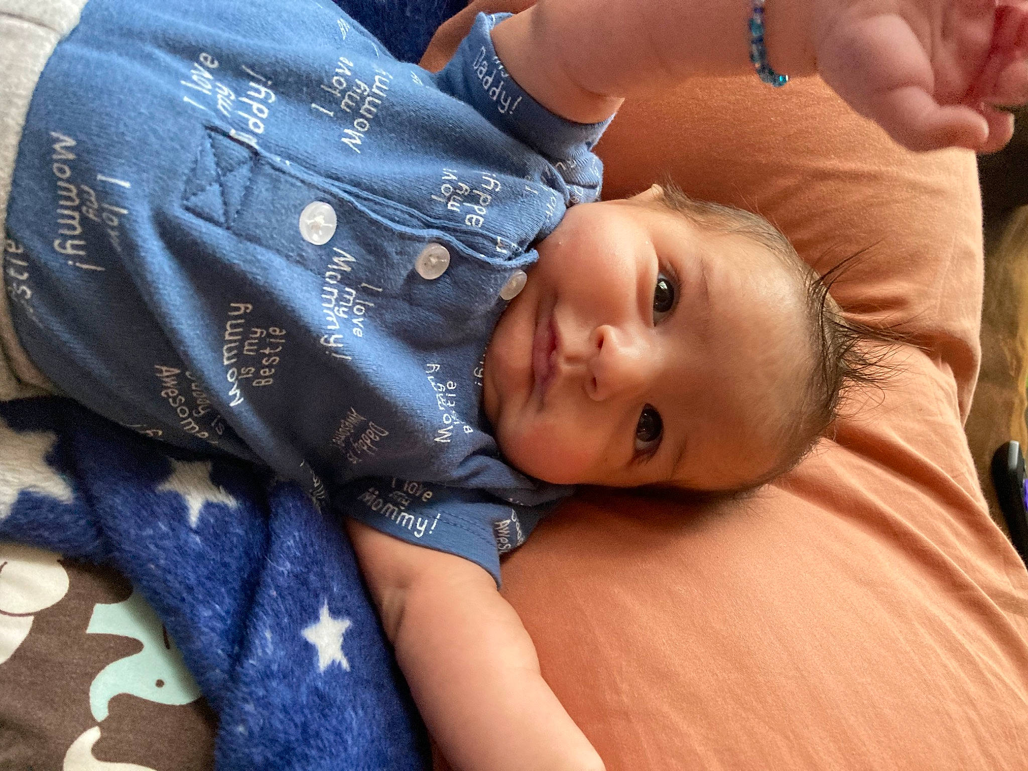 Gianni is registered to the contest to win money with this photo: abdomen, arm, baby, baby_toddler_clothing, cheek, chest, child, comfort, denim, electric_blue, eyelash, hand, happy, nail, pattern, person, sitting, skin, thumb, toddler