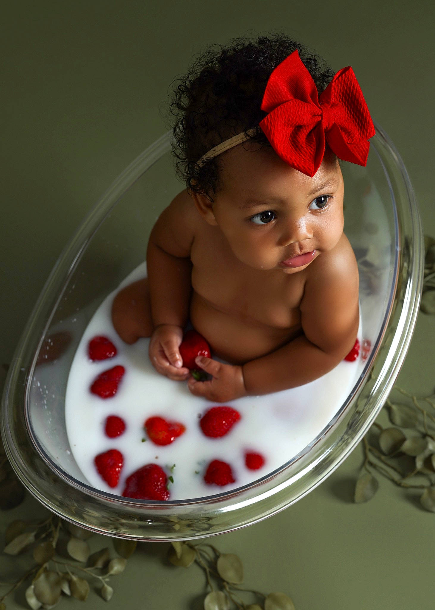 Makenna is registered to the contest to win money with this photo: baby, baby_toddler_clothing, bathing, dishware, food, fruit, hat, ingredient, lip, nail, party_supply, person, plant, red, serveware, skin, strawberry, sugar_cake, sweetness, tableware