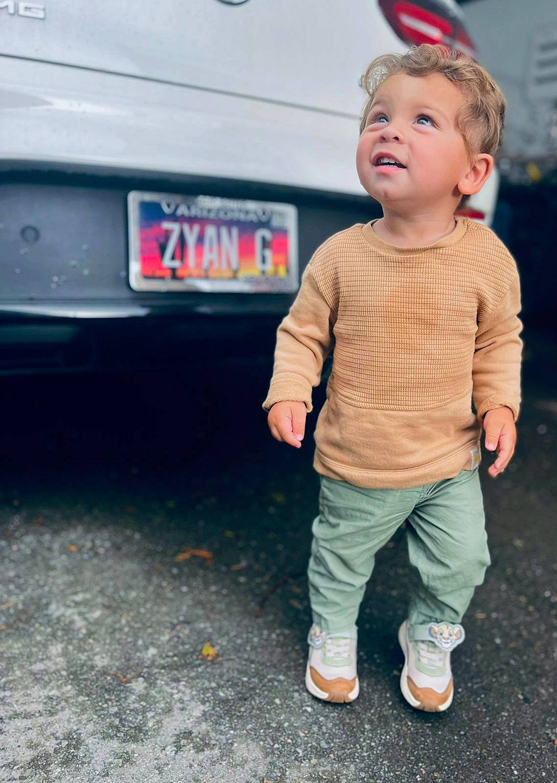 Zyan joined the competition — help win amazing prizes! asphalt, automotive_exterior, automotive_lighting, automotive_tail_brake_light, automotive_tire, automotive_wheel_system, baby, baby_toddler_clothing, bumper, car, family_car, gas, happy, motor_vehicle, person, tire, toddler, trunk, vehicle, vehicle_door