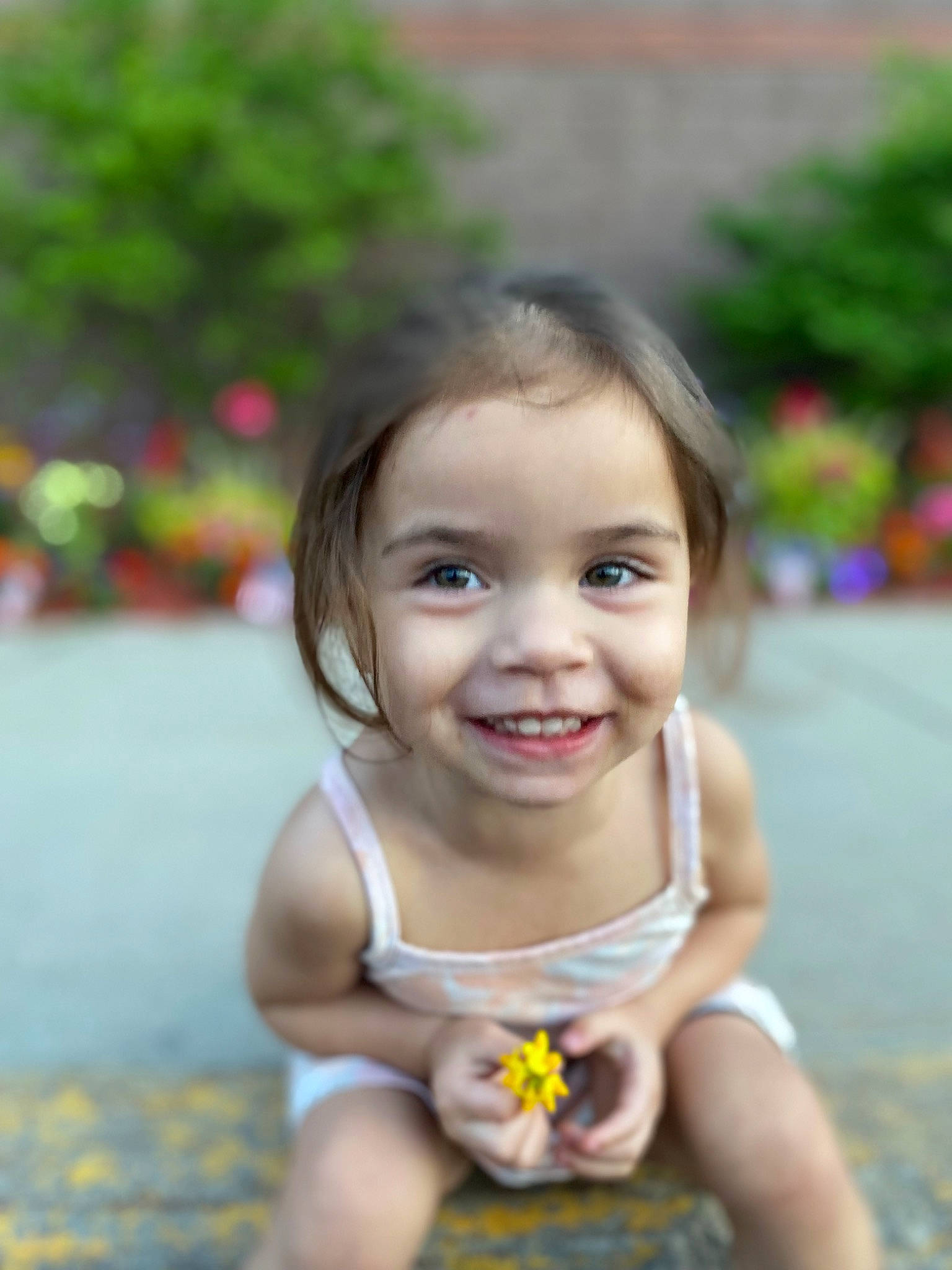 Lillianna is registered to the contest to win money with this photo: baby, baby_toddler_clothing, child, eye, face, flash_photography, fun, grass, happy, iris, joy, leisure, people_in_nature, person, plant, recreation, sitting, skin, smile, toddler