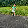 toddler, child, outdoor, forest, greenery, grass, path, asphalt, overalls, shirt, shoes, smiling, walking, portrait, nature, park, trees, playful, daylight, photography