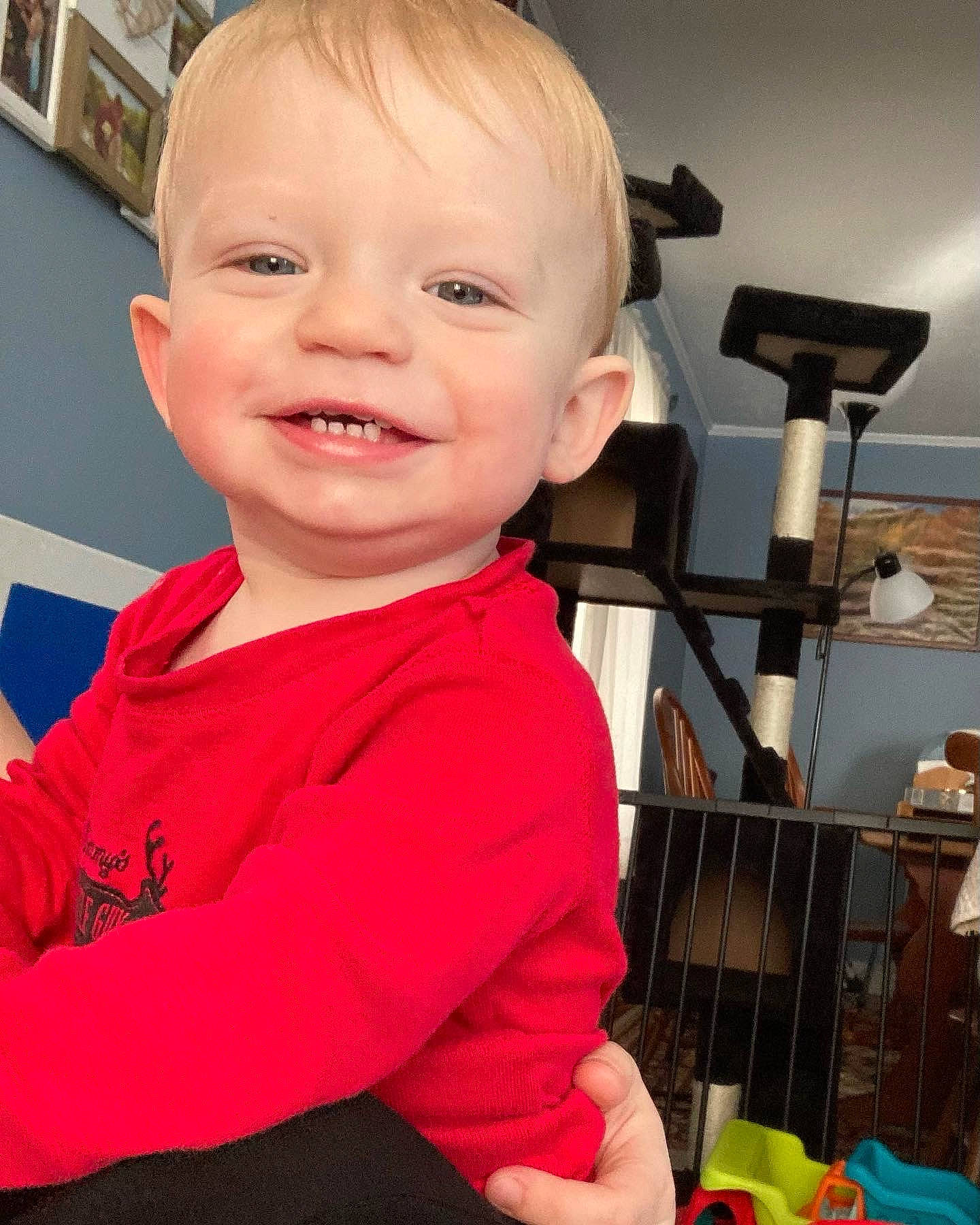 Calvin is registered to the contest to win money with this photo: baby, baby_toddler_clothing, cheek, child, chin, ear, eyebrow, eyelash, finger, fun, happy, iris, joy, nose, person, room, skin, sleeve, smile, standing