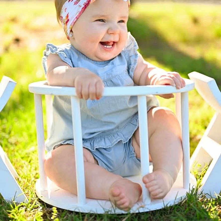 Saylor joined the competition — help win amazing prizes! baby, child, chubby_legs, clothing, cute, daylight, grass, happy, head, headband, infant, nature, outdoor, playful, portrait, sitting, smiling, summer, sunlight, wooden_basket