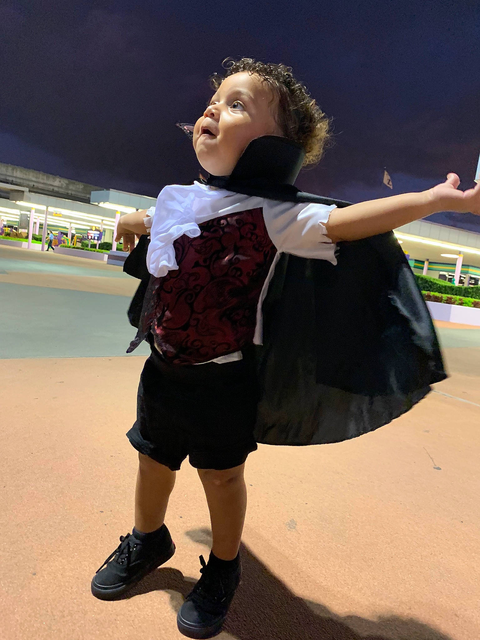 Jalias is registered to the contest to win money with this photo: child, costume, footwear, fun, gesture, happy, jumping, leg, person, photography, recreation, shoe, smile, toddler, vacation