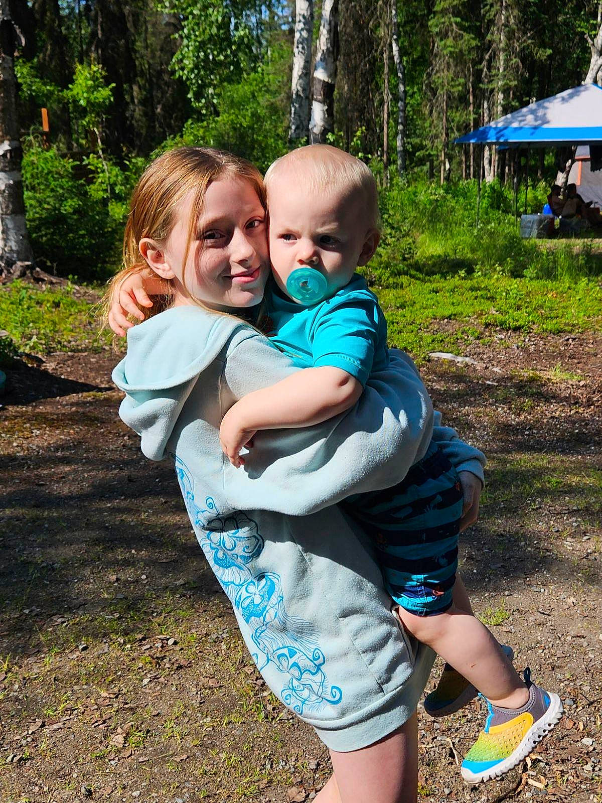 Carter is registered to the contest to win money with this photo: baby, baby_toddler_clothing, blue, child, electric_blue, forest, fun, garden, grass, happy, interaction, joy, leisure, people_in_nature, person, plant, play, recreation, sitting, soil