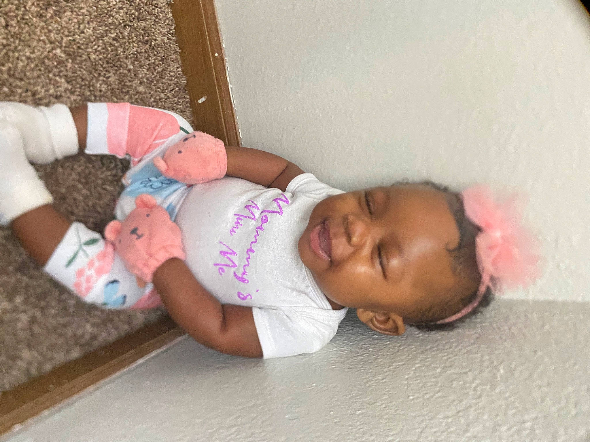 Yari is registered to the contest to win money with this photo: abdomen, arm, baby, baby_products, baby_toddler_clothing, cheek, child, comfort, finger, flooring, fun, happy, human_body, leg, person, pink, room, skin, smile, thigh