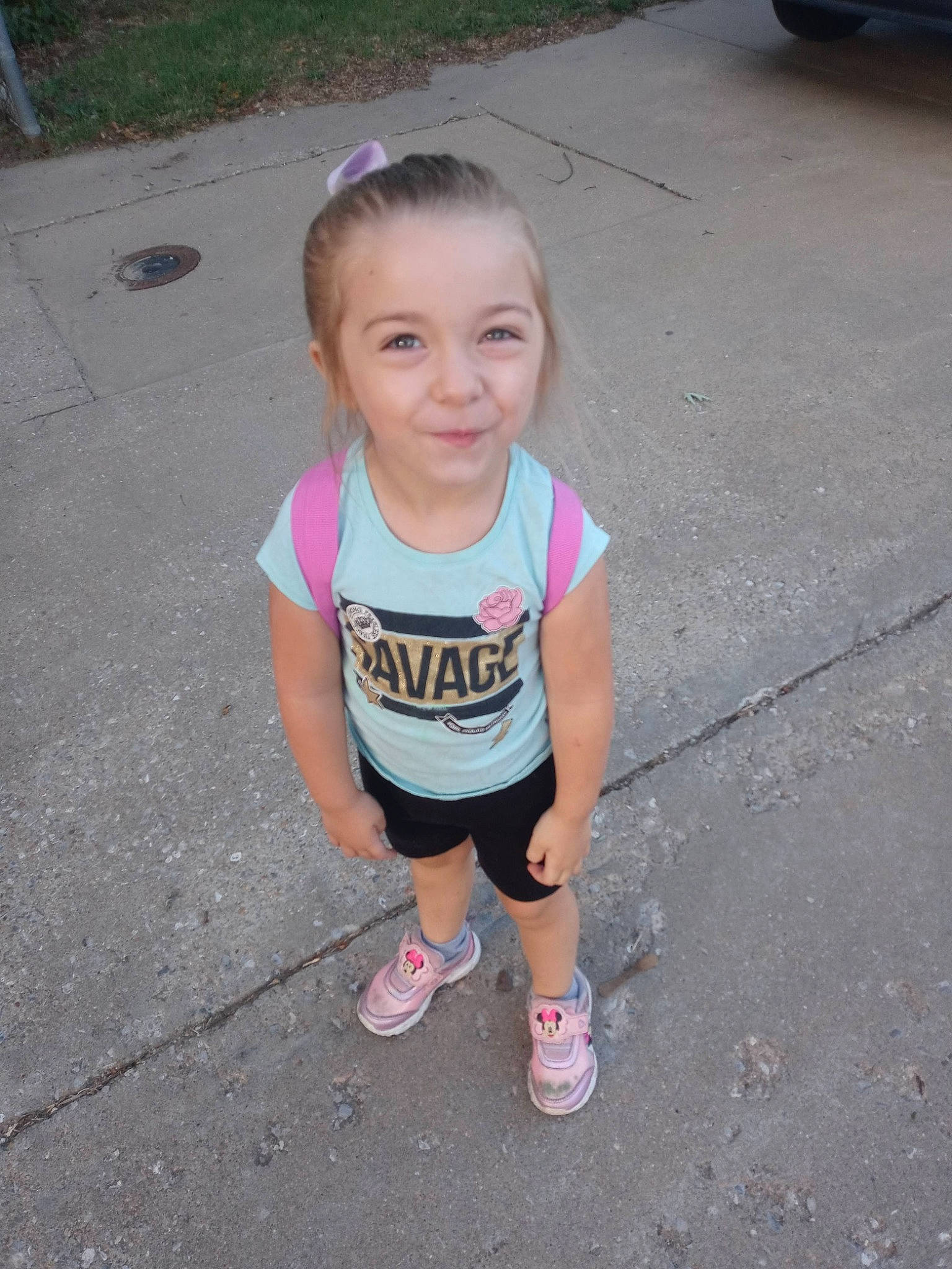 Reggie is registered to the contest to win money with this photo: asphalt, chin, cool, fun, grass, hair, happy, head, human_body, joy, leisure, person, pink, road, road_surface, shorts, sidewalk, smile, t_shirt, tar