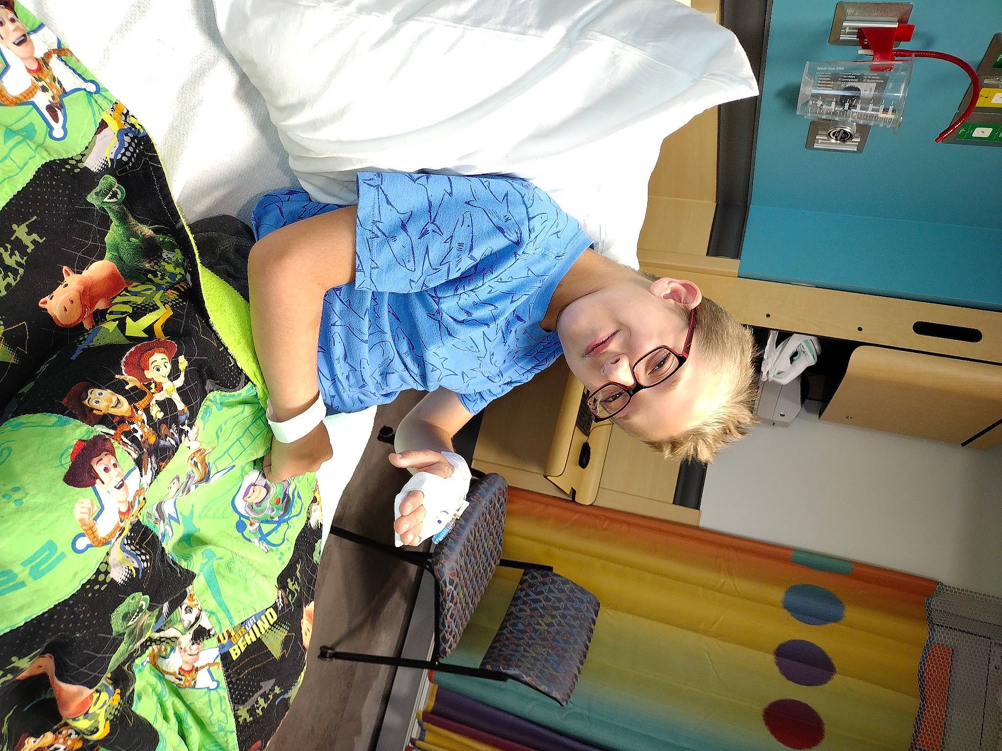 Cory is registered to the contest to win money with this photo: child, design, fun, joy, leisure, machine, pattern, person, product, recreation, room, service, sleeve, smile, space, t_shirt, visual_arts