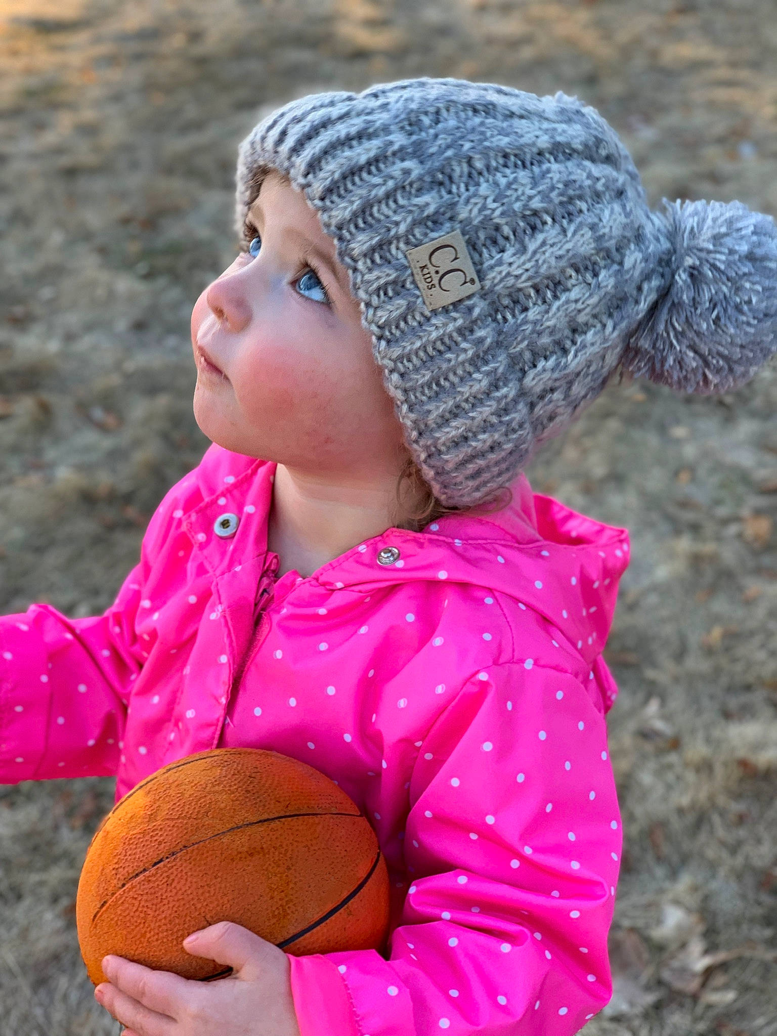 Matilda is registered to the contest to win money with this photo: beanie, bonnet, cap, child, hat, headgear, headwear, knit_cap, knitting, neck, person, pink, play, toddler, wool, woolen