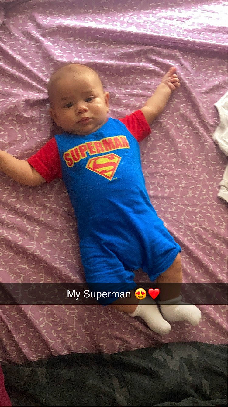 Miguel is registered to the contest to win money with this photo: baby, baby_products, baby_toddler_clothing, child, cool, electric_blue, finger, flooring, fun, hand, happy, human, leisure, linens, person, play, sitting, sleeve, t_shirt, textile