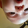 baby, background, candid, ceiling_fan, child, closeup, expression, eye, face, head, human, indoor, mouth_open, nose, person, playful, portrait, skin, upside_down, young