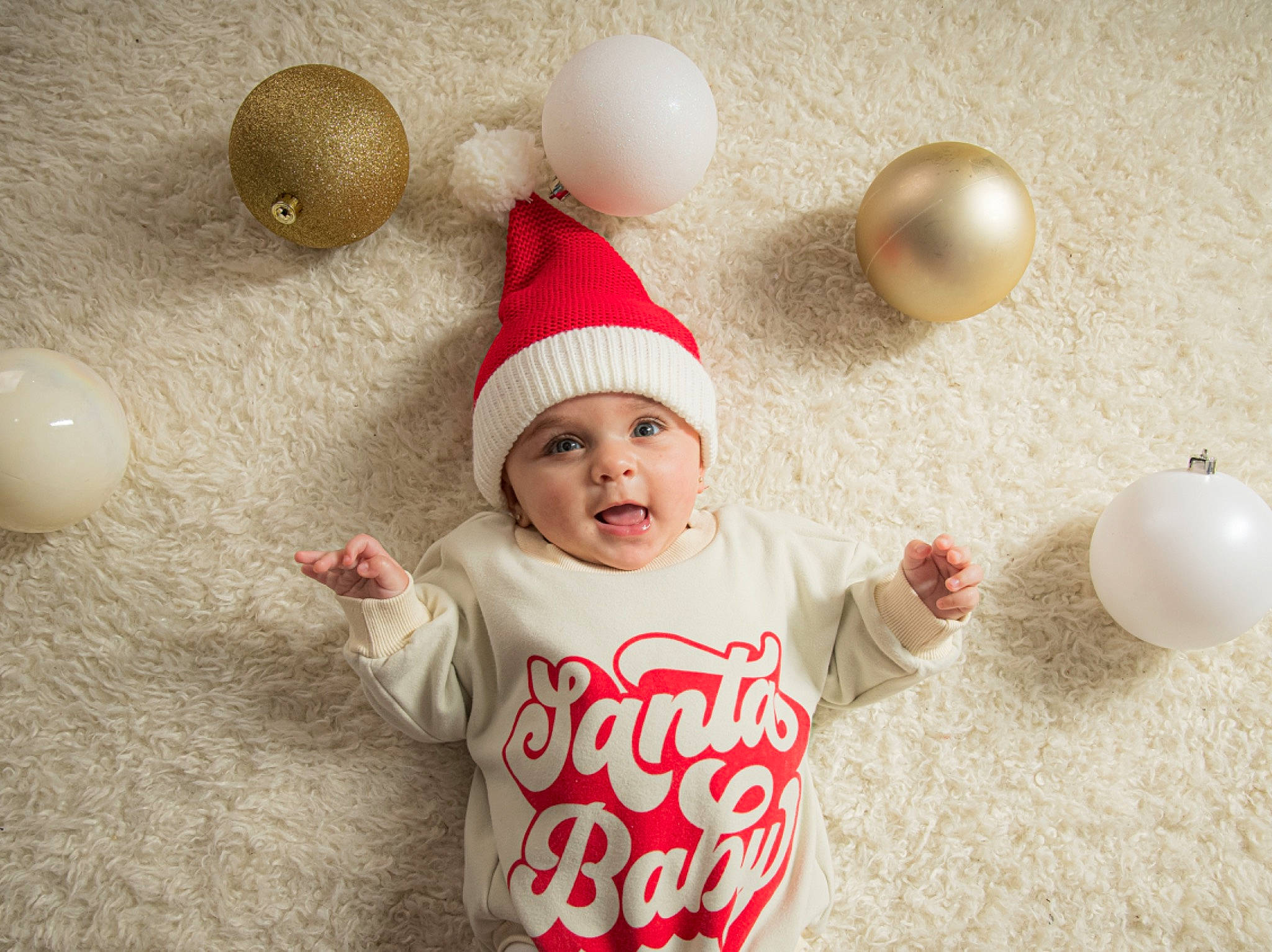Kaylen is registered to the contest to win money with this photo: baby, baby_toddler_clothing, balloon, child, christmas_decoration, christmas_ornament, event, fun, happy, headwear, holiday, holiday_ornament, mammal, ornament, party_supply, person, sleeve, smile, t_shirt, toddler