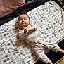 Elijah joined the competition — help win amazing prizes! baby, infant, blanket, pajamas, pattern, floor, carpet, texture, person, child, smiling, cute, indoors, lying_down, clothing, foot, hand, face, head, soft