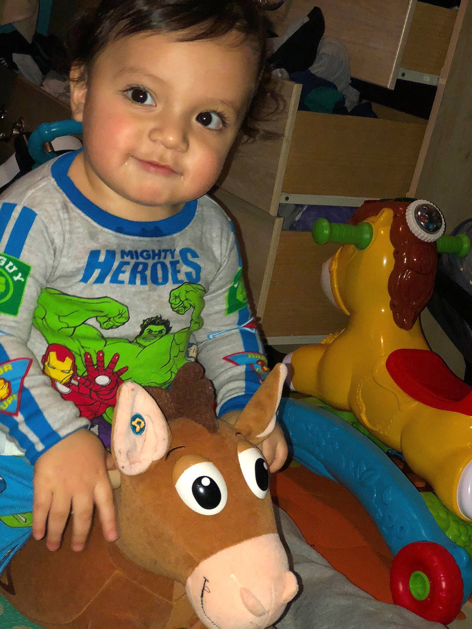 Lionel is registered to the contest to win money with this photo: baby, baby_toys, child, fawn, head, person, play, stuffed_toy, toddler, toy