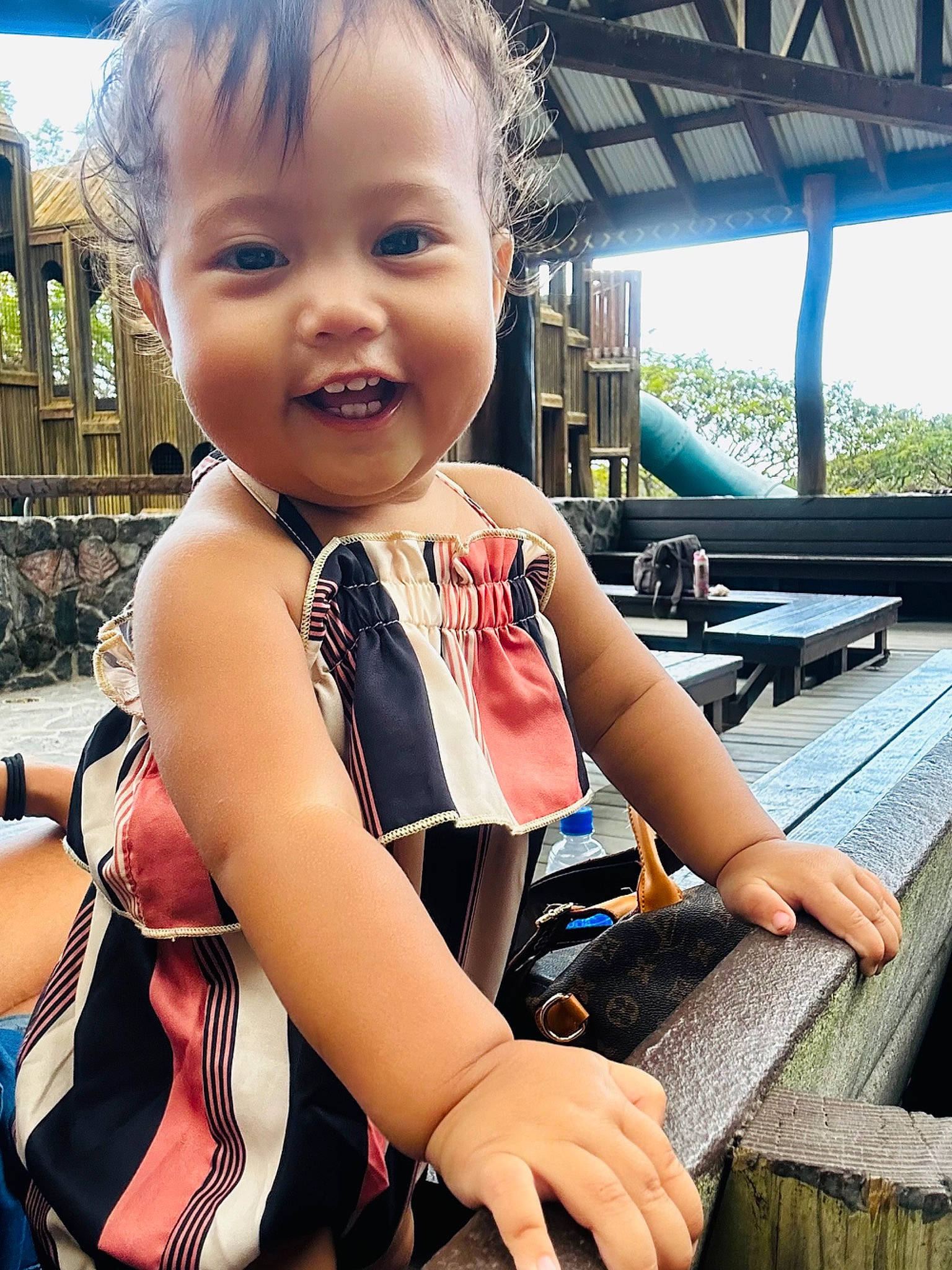 Phoebe Maleia is registered to the contest to win money with this photo: baby_toddler_clothing, blond, child, cool, fun, hairstyle, happy, human_leg, leisure, person, personal_protective_equipment, recreation, sitting, skin, smile, thigh, thumb, toddler, travel, vacation