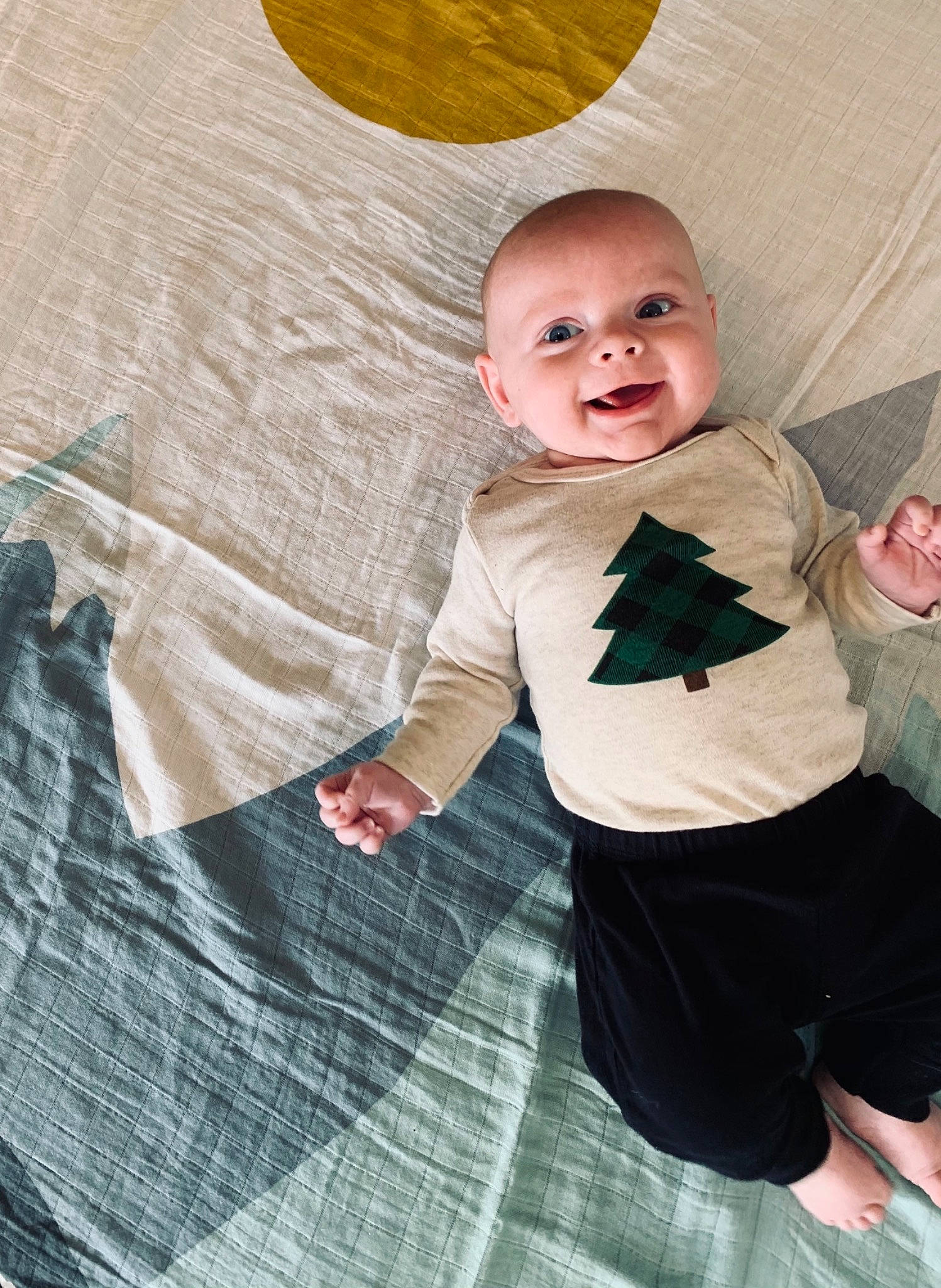 Aaden is registered to the contest to win money with this photo: abdomen, ankle, baby, baby_products, baby_toddler_clothing, child, elbow, foot, humour, linens, long_sleeved_t_shirt, pajamas, person, sleeve, sock, stomach, textile, thumb, toddler