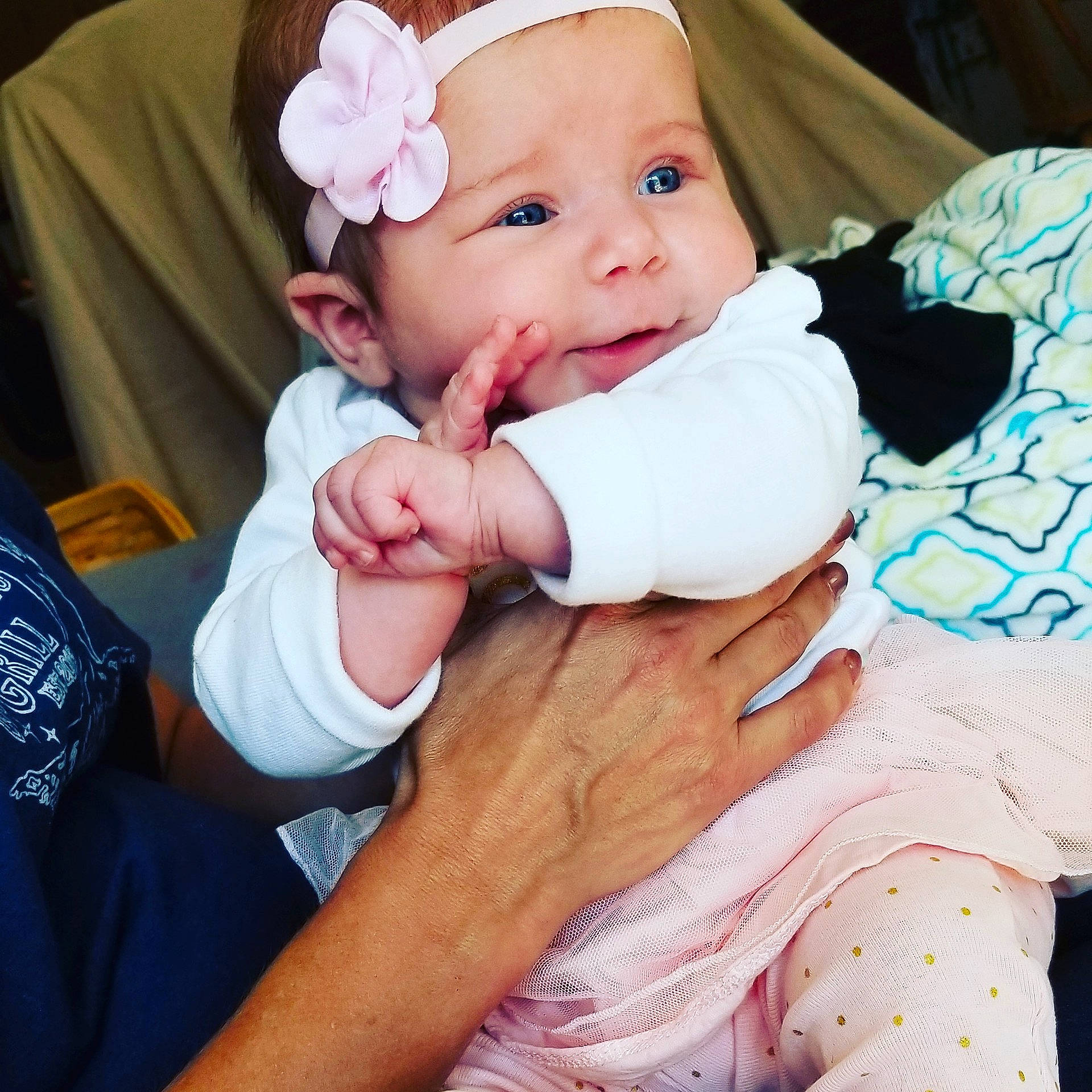 Sophia is registered to the contest to win money with this photo: arm, cheek, child, ear, finger, girl, hair_accessory, hand, headgear, infant, mouth, nose, person, product, skin, toddler