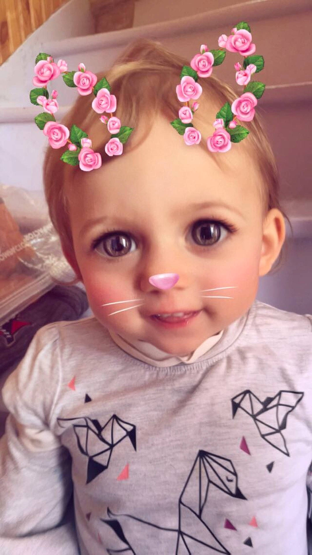 Samia participe au concours pour gagner de l'argent avec cette photo : brown_hair, cheek, child, doll, ear, face, flower, forehead, girl, hair_accessory, head, headband, headgear, headpiece, infant, petal, pink, product, skin, toddler