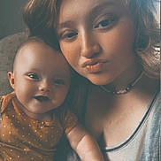 Emilia joined the competition — help win amazing prizes! baby, child, woman, selfie, portrait, smile, pout, indoor, casual, clothing, onesie, polka_dot, necklace, curly_hair, light, face, skin, happy, toddler, family