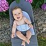 baby, smiling, blue_eyes, babybjorn, chair, outdoor, flower, hydrangea, green_leaves, grass, pebble, nature, happy, infant, bare_chest, bracelet, summer, sunlight, cute, portrait