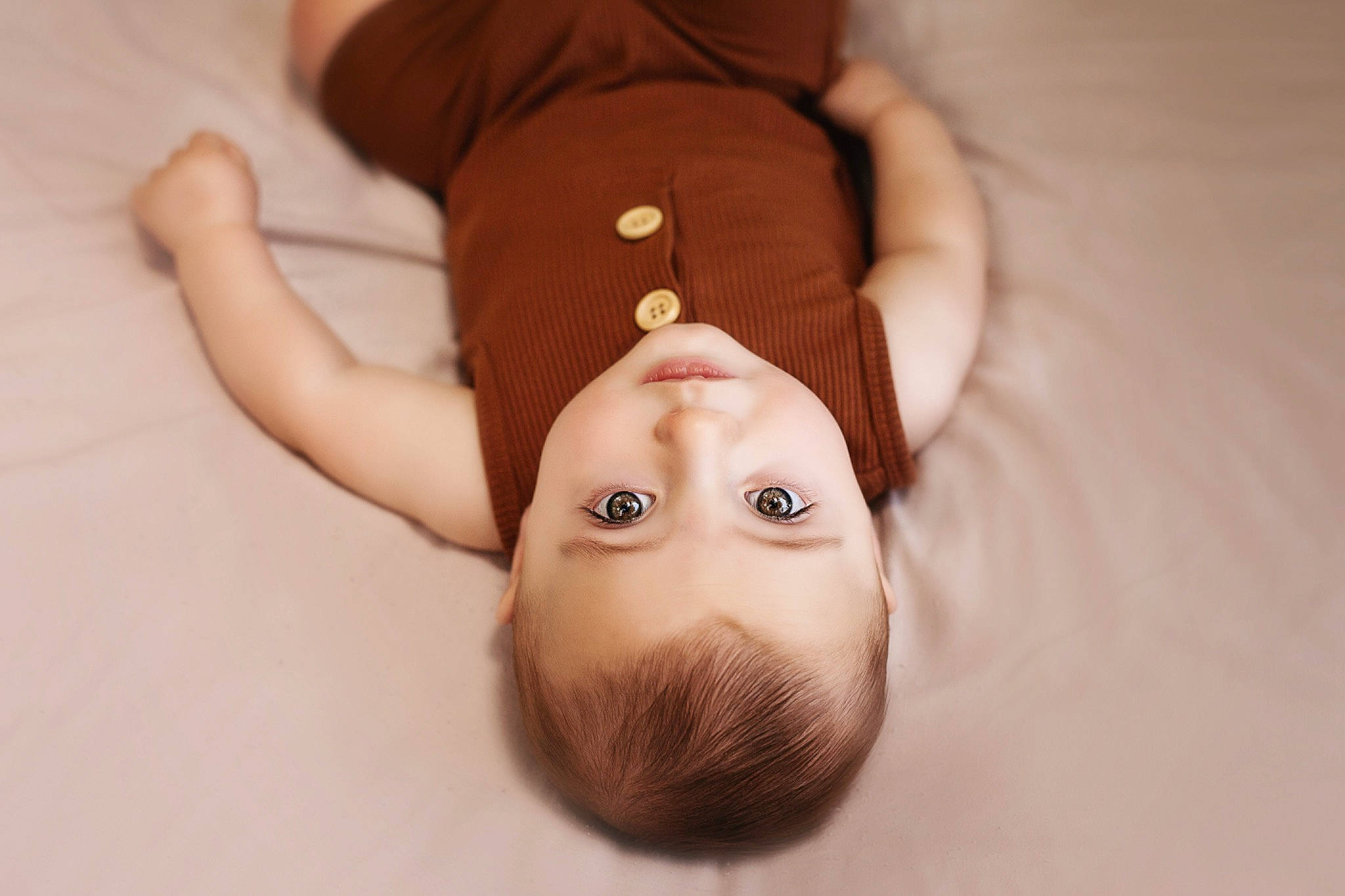 Rhodes is registered to the contest to win money with this photo: baby, brown, child, ear, fawn, hand, head, person, skin, stuffed_toy, toddler, toy