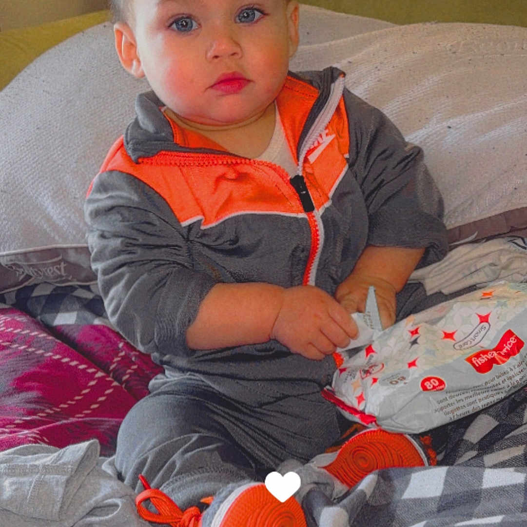 Karsyon is registered to the contest to win money with this photo: baby, ball, bed, clothing, couch, cushion, face, football, furniture, glove, head, homedecor, indoors, pants, person, photography, portrait, soccer, soccerball, sport
