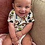 baby, blanket, child, clothing, couch, cute, eyebrows, fabric, face, hand, happy, head, indoor, infant, legs, mickey_mouse, person, sitting, skin, smiling