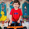 Yeshua joined the competition — help win amazing prizes! child, toddler, smiling, curly_hair, red_shirt, racing_car, toy_car, birthday, decorations, colorful, cartoon, indoor, celebration, happy, portrait, vehicle, playful, young_child, fun, party
