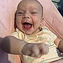 Winnie is registered to the contest to win money with this photo: baby, smiling, laughing, child, infant, onesie, floral_pattern, pink_chair, happy, cute, portrait, indoor, furniture, person, skin, hand, expression, seat, young, closeup