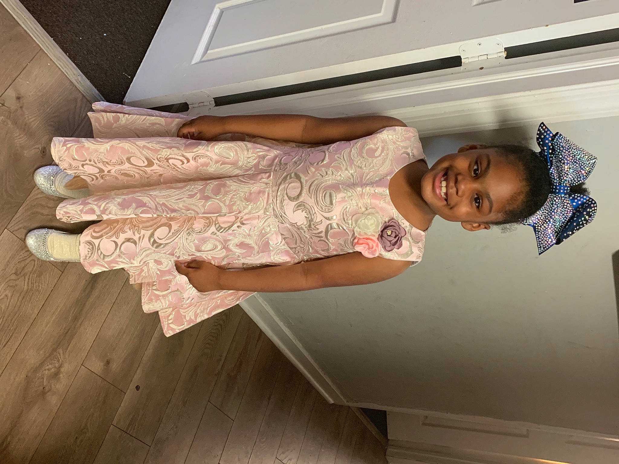 Kennedy joined the competition — help win amazing prizes! comfort, dress, elbow, fashion_design, flooring, gesture, hardwood, human_leg, joy, linens, pattern, person, room, shoulder, smile, stairs, standing, textile, thigh, waist