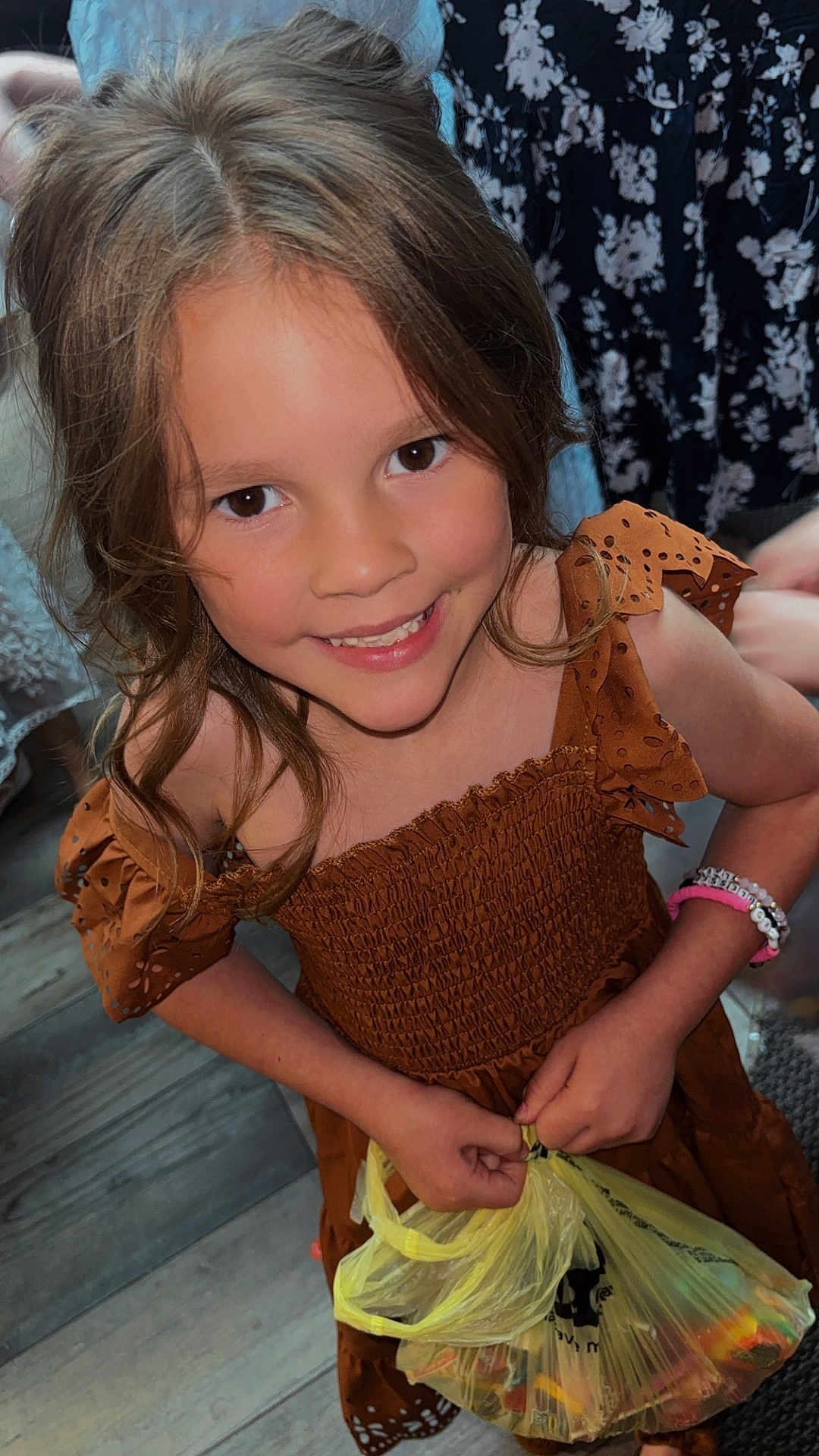 Brooklyn joined the competition — help win amazing prizes! child, girl, smiling, brown_hair, dress, bracelet, plastic_bag, indoor, wooden_floor, patterned_clothing, happy, portrait, person, holding, casual, cute, standing, colorful, young, fashion