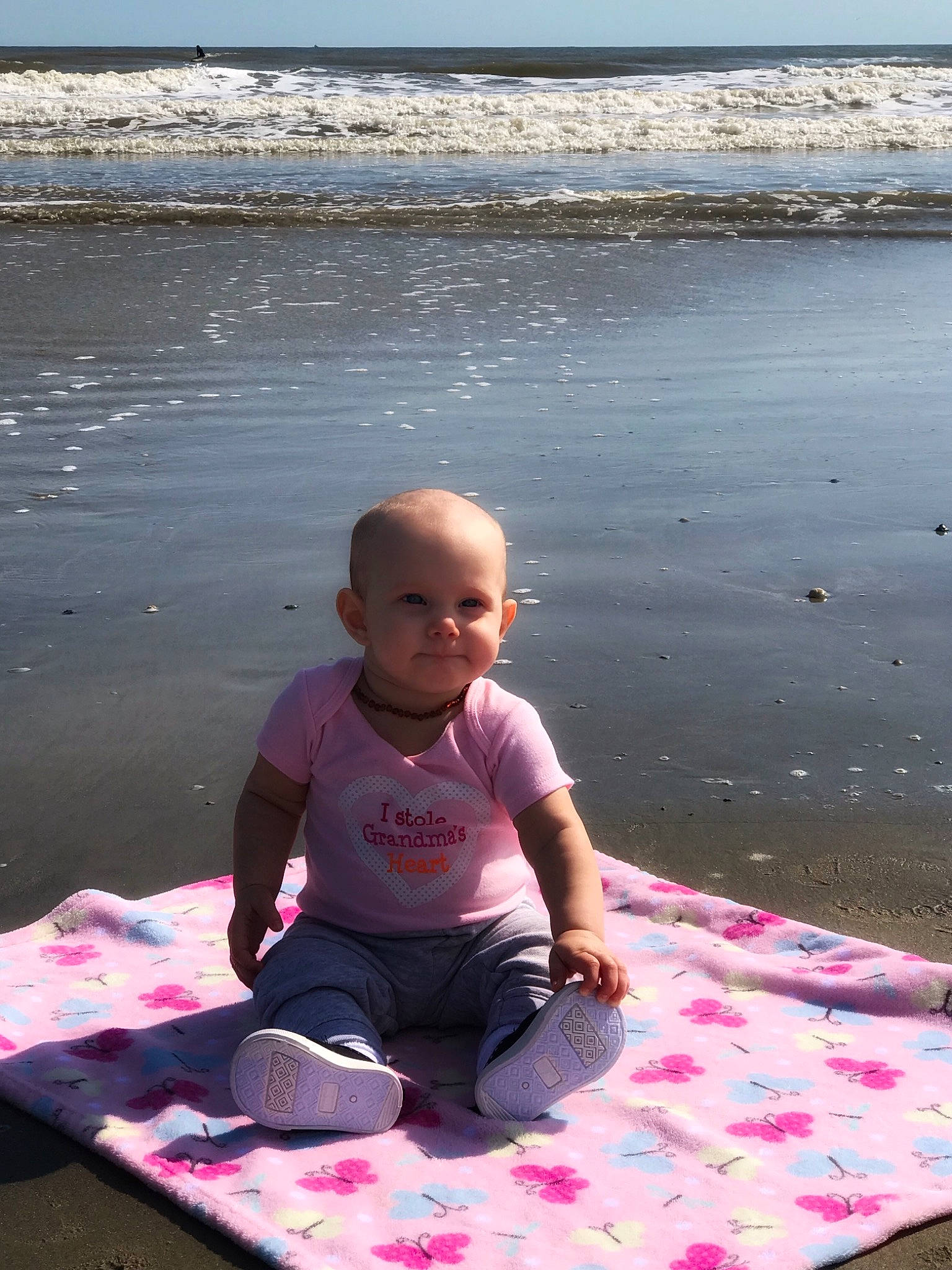 Mckenzie is registered to the contest to win money with this photo: beach, child, fun, leisure, ocean, person, pink, sand, sea, summer, toddler, vacation