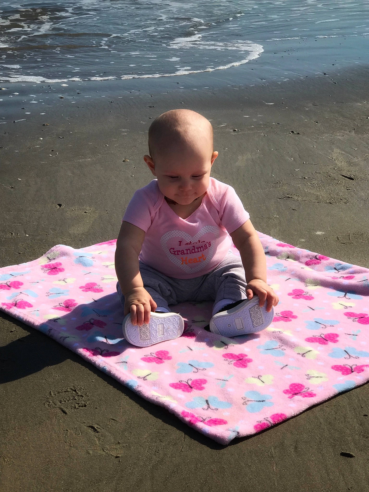 Mckenzie is registered to the contest to win money with this photo: child, fun, leisure, person, pink, play, recreation, sand, summer, toddler, vacation