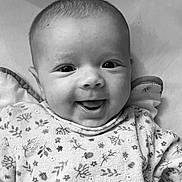 Marie participe au concours pour gagner de l'argent avec cette photo : baby, smiling, face, infant, clothing, pattern, happy, portrait, cute, child, apparel, expression, young, closeup, person, sleeve, texture, eyes, mouth, skin
