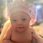 Zuriah joined the competition — help win amazing prizes! adorable, baby, child, chubby, closeup, cute, expression, face, hand, headwear, human, indoors, infant, newborn, person, pink_shower_cap, portrait, skin, smile, soft_light