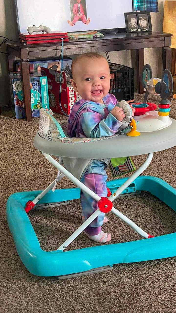 La'Naya is registered to the contest to win money with this photo: baby, baby_playing_with_toys, baby_toddler_clothing, blue, chair, child, city, fun, home_appliance, leisure, outdoor_furniture, outdoor_play_equipment, person, play, recreation, shelf, shorts, sitting, smile, toddler