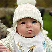 Alfie joined the competition — help win amazing prizes! baby, child, face, hat, knit_hat, pom_pom, bib, rabbit_illustration, hand, holding_hand, outdoor, portrait, cute, warm_clothing, winter, cold_weather, person, close_up, blue_eyes, soft_focus