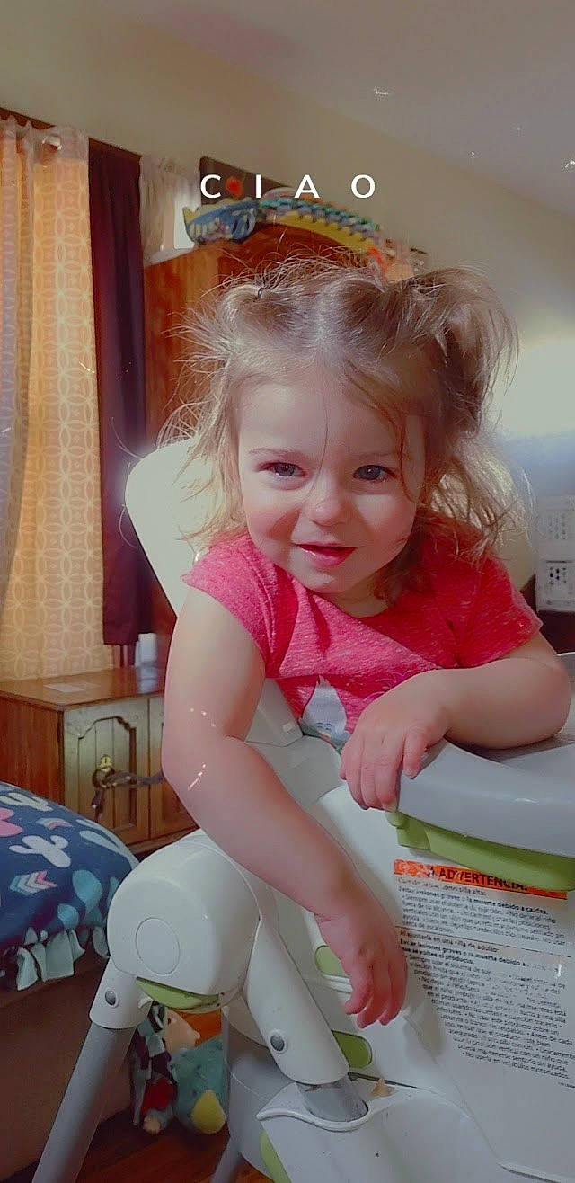 Harmoni is registered to the contest to win money with this photo: baby, baby_products, baby_toddler_clothing, blond, cheek, child, curtain, fashion_accessory, fun, happy, human_leg, jewellery, person, play, room, sitting, skin, smile, sock, thigh