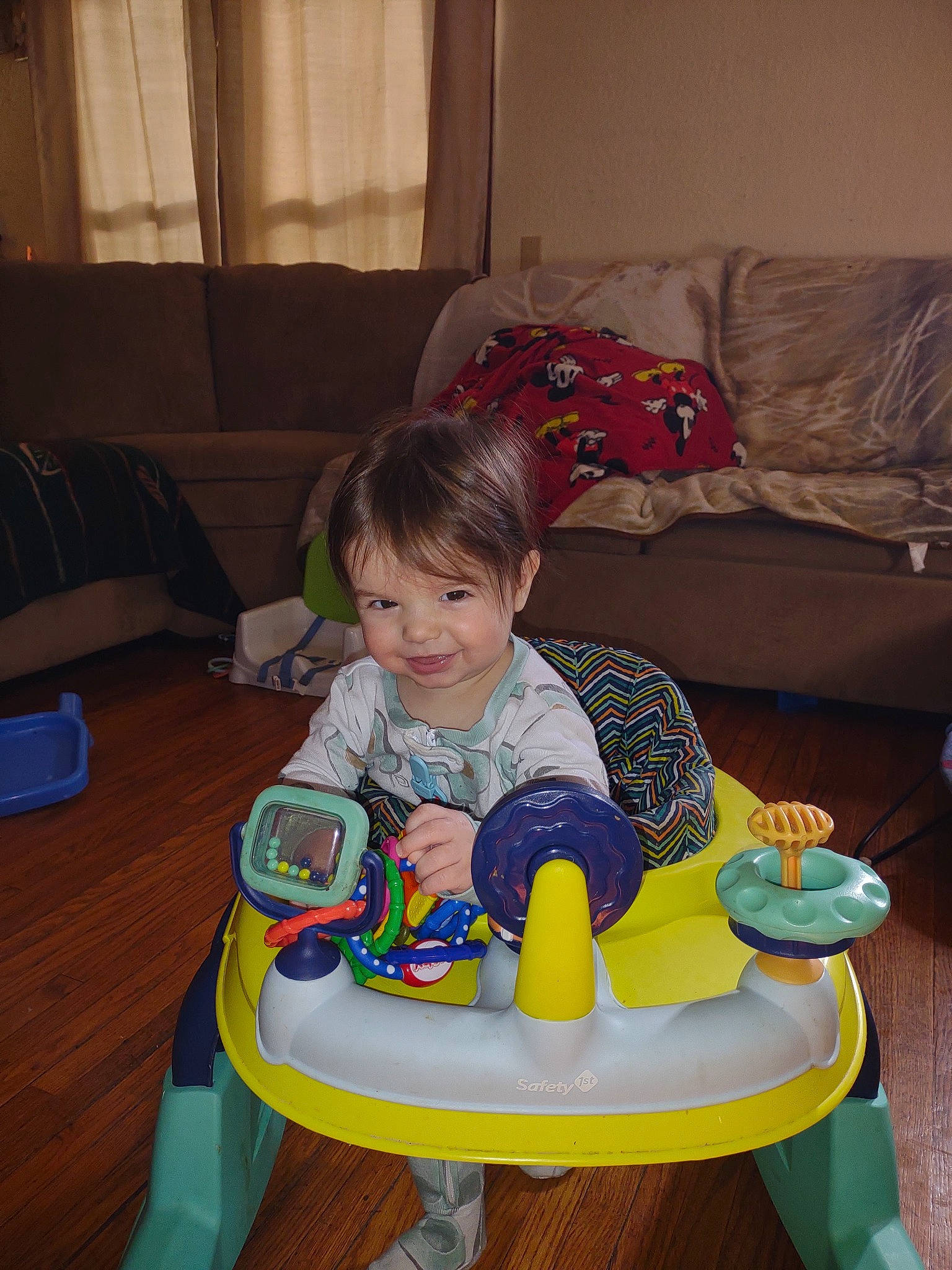 Rhythm is registered to the contest to win money with this photo: baby, baby_toddler_clothing, chair, child, comfort, couch, curtain, eye, flooring, fun, furniture, joy, lap, living_room, person, room, sharing, sitting, smile, toddler