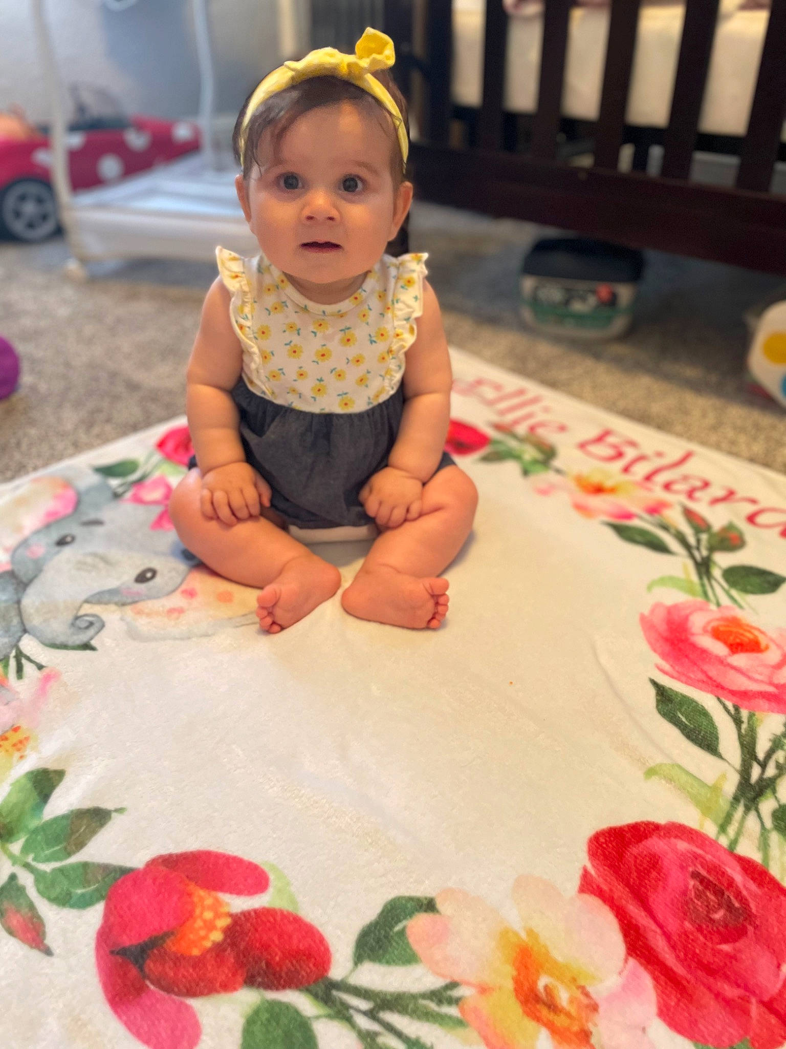 Ellie is registered to the contest to win money with this photo: baby, baby_toddler_clothing, beauty, child, floor, flooring, flower, green, happy, orange, person, petal, photograph, pink, plant, red, skin, smile, snapshot, toddler