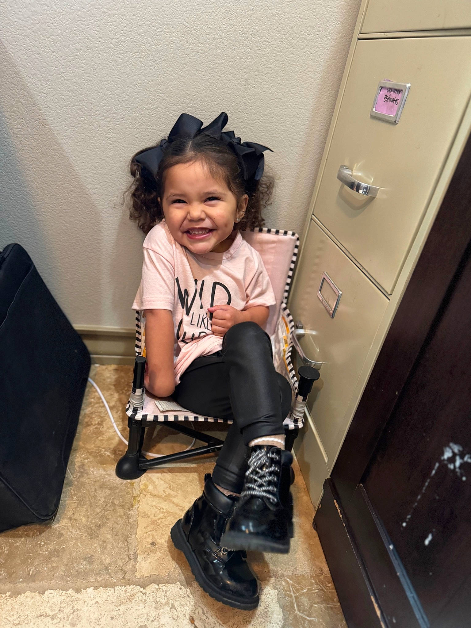 Camila Rae is registered to the contest to win money with this photo: black_hair, cabinetry, drawer, fashion_design, flash_photography, footwear, fun, happy, joy, knee, knee_high_boot, leg, locker, material_property, person, shoe, shoulder, sleeve, smile, sneakers