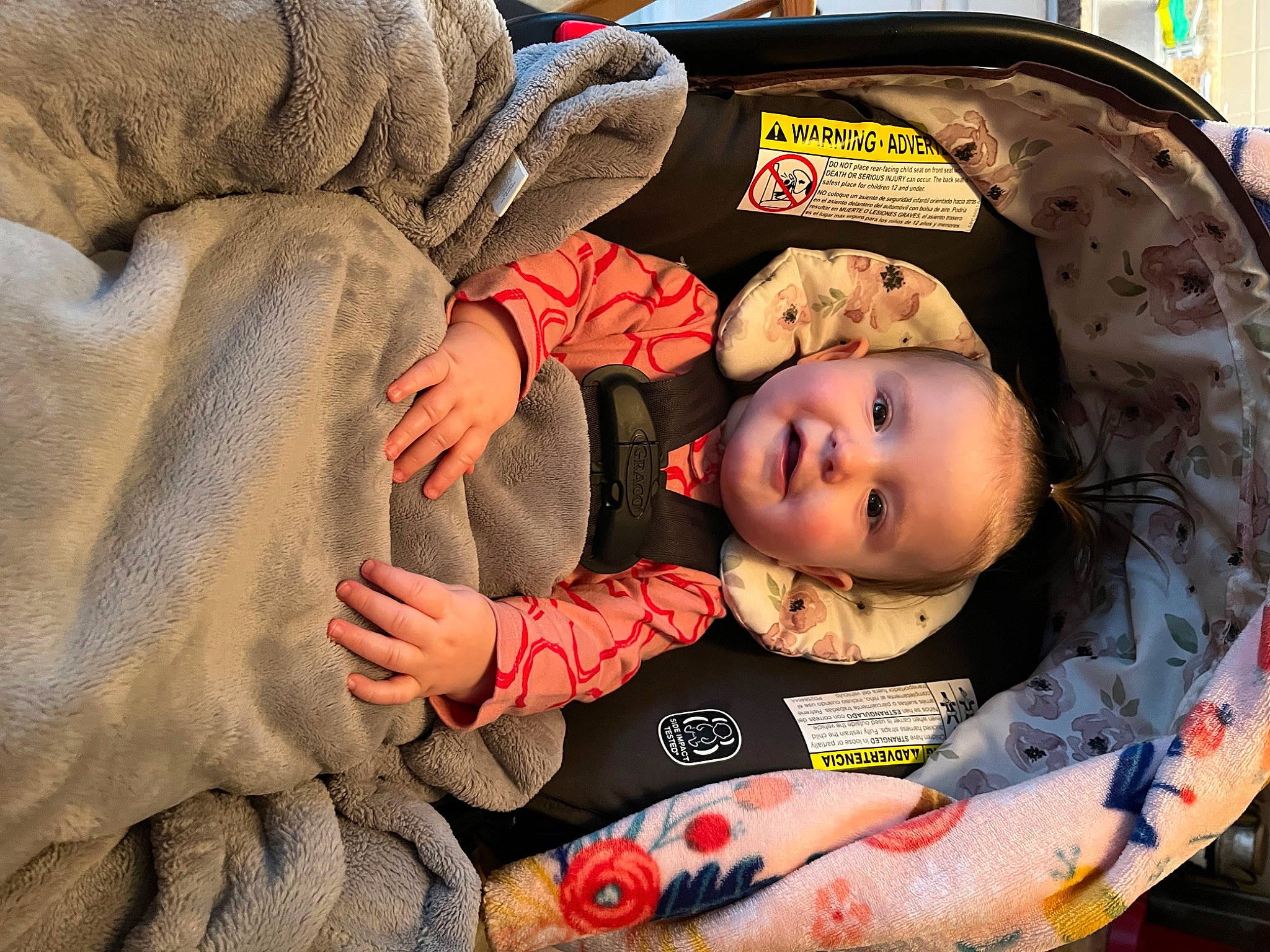 Kallie joined the competition — help win amazing prizes! baby, baby_carriage, baby_products, baby_safety, baby_toddler_clothing, carmine, cheek, child, comfort, eye, facial_expression, gesture, linens, nail, person, room, sitting, skin, textile, toddler