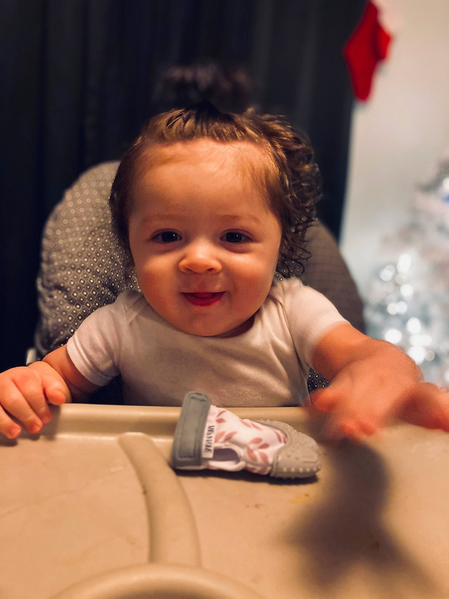 Angelo is registered to the contest to win money with this photo: baby, baby_toddler_clothing, cheek, child, event, finger, fun, gesture, hair, hand, happy, human, iris, nose, person, room, sitting, skin, smile, thumb