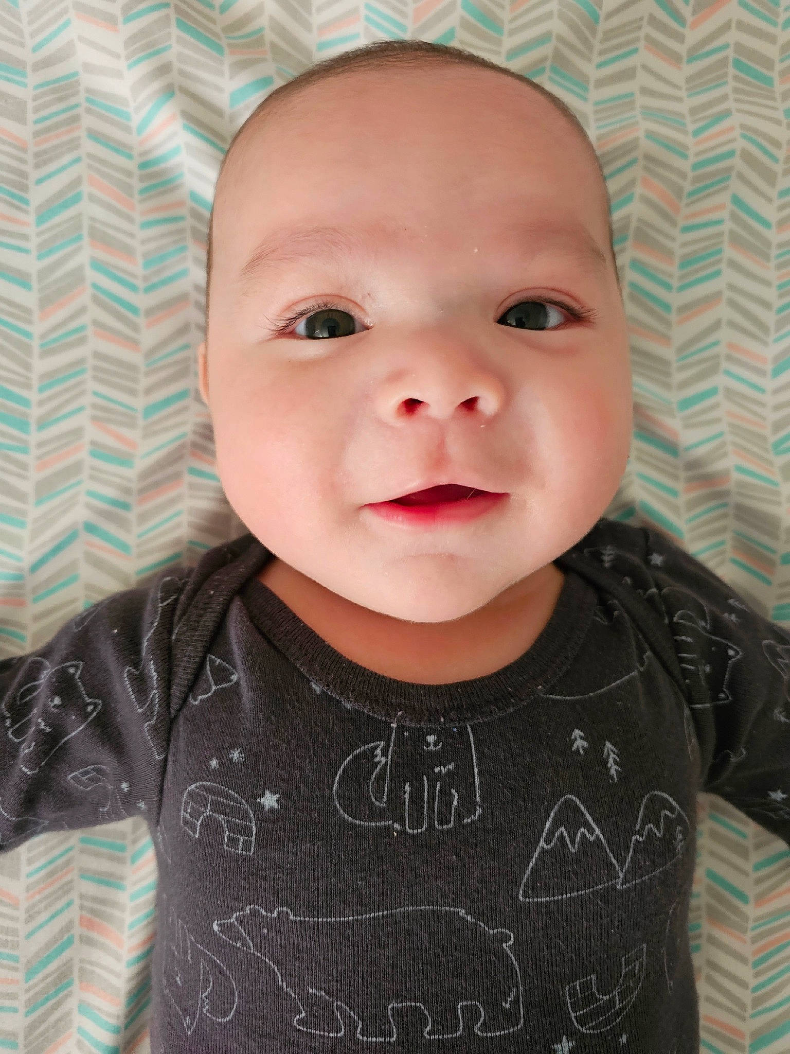 Gabriel Jacy is registered to the contest to win money with this photo: baby, baby_toddler_clothing, cheek, child, chin, eye, eyebrow, eyelash, facial_expression, happy, iris, lip, mouth, neck, nose, outerwear, person, skin, sleeve, t_shirt