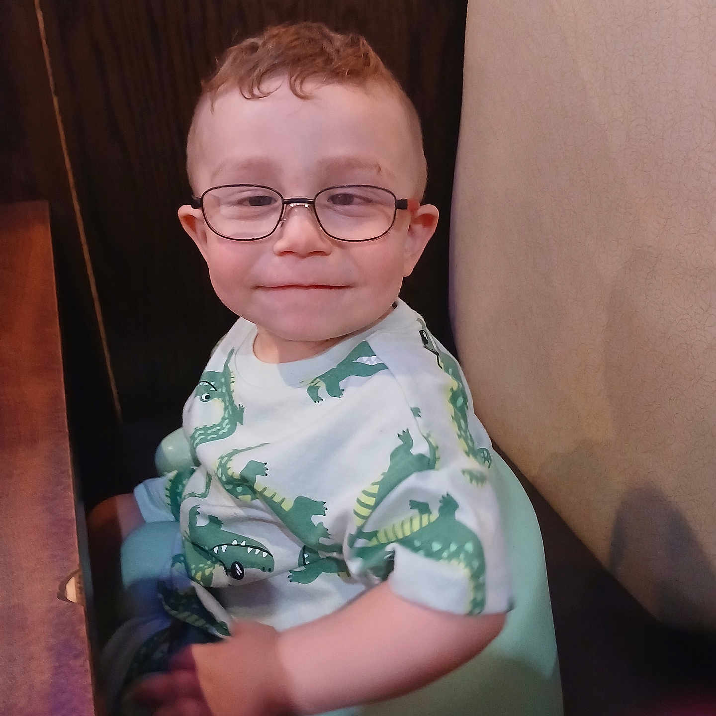 Bentley joined the competition — help win amazing prizes! accessories, baby, bodypart, clothing, dress, face, finger, furniture, glasses, hand, happy, head, indoors, person, photography, portrait, shirt, sitting, smile, t_shirt