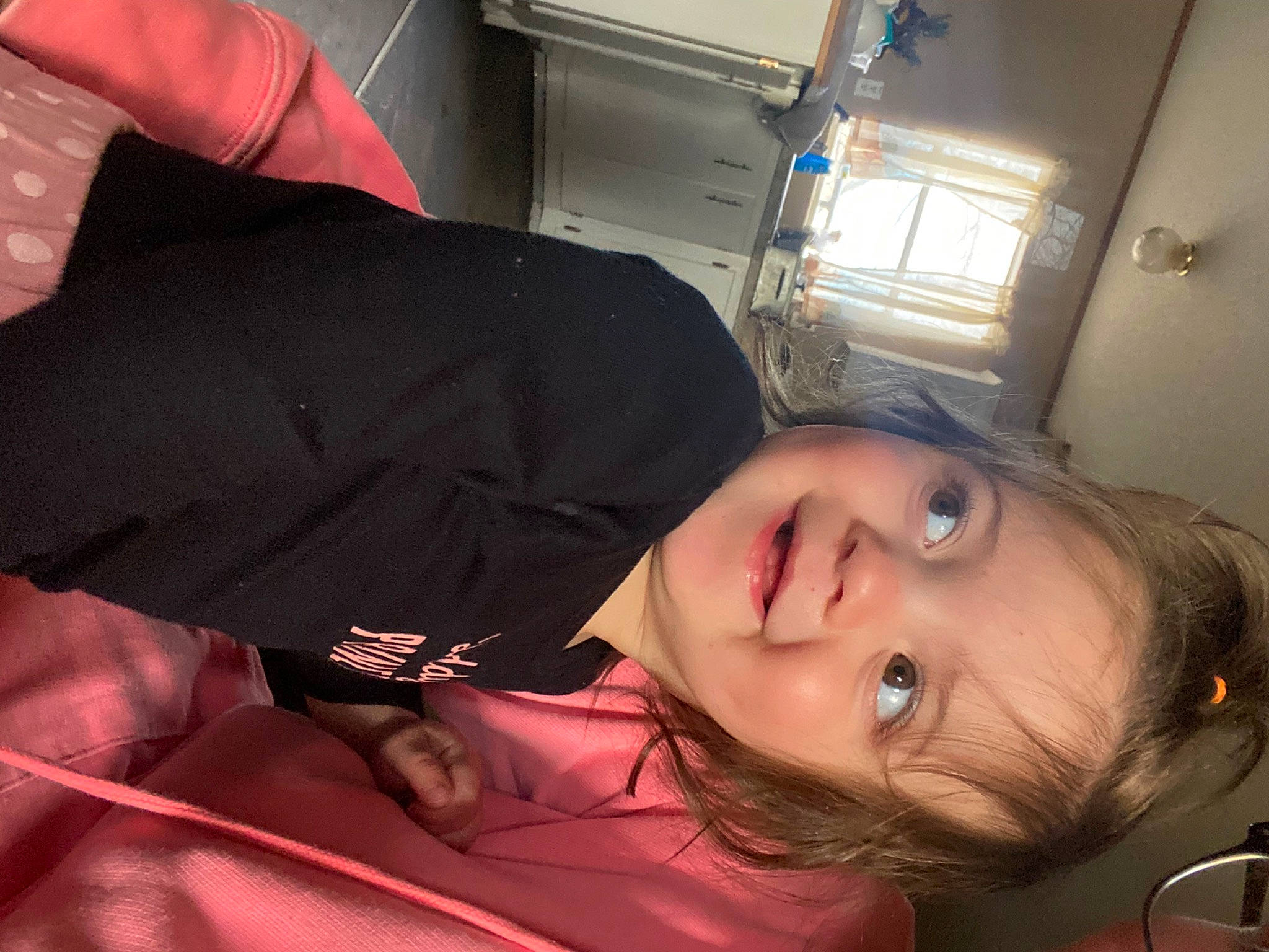 Everleigh is registered to the contest to win money with this photo: black_hair, cheek, child, comfort, cool, ear, elbow, eyelash, forehead, fun, happy, jaw, joy, lip, mouth, neck, nose, person, sitting, sleeve