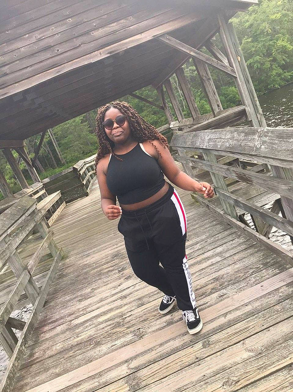 Cheyenne is registered to the contest to win money with this photo: bridge, footwear, fun, happy, joy, leg, leisure, nonbuilding_structure, person, photography, recreation, shoe, sportswear, tree, vacation, wood