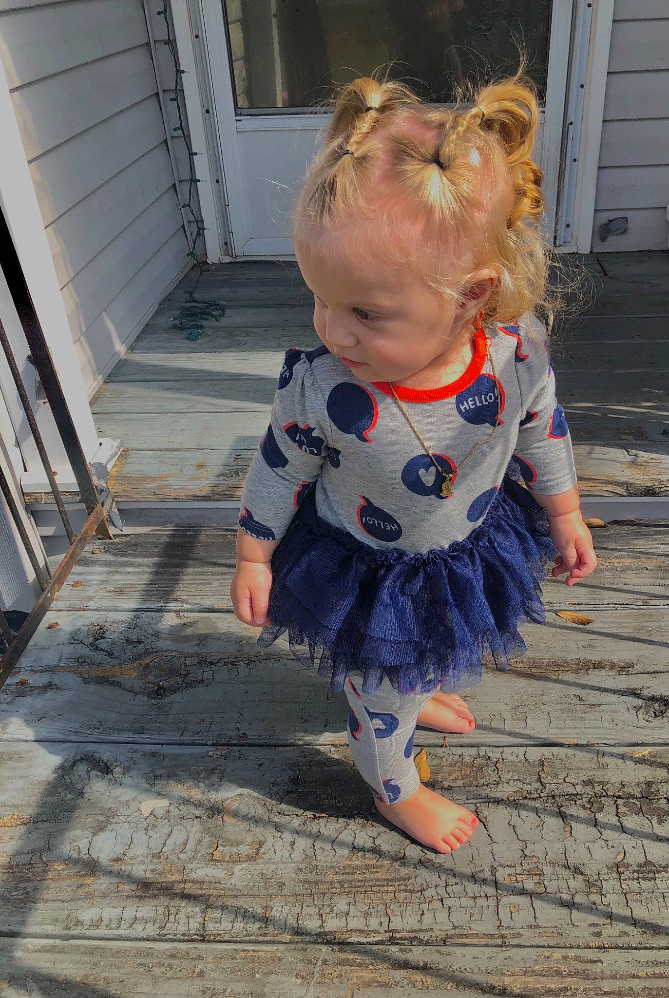 Carleigh is registered to the contest to win money with this photo: baby, baby_toddler_clothing, barefoot, child, day_dress, door, dress, electric_blue, floor, flooring, foot, human_body, human_leg, pattern, person, road_surface, sleeve, sunglasses, toddler, waist